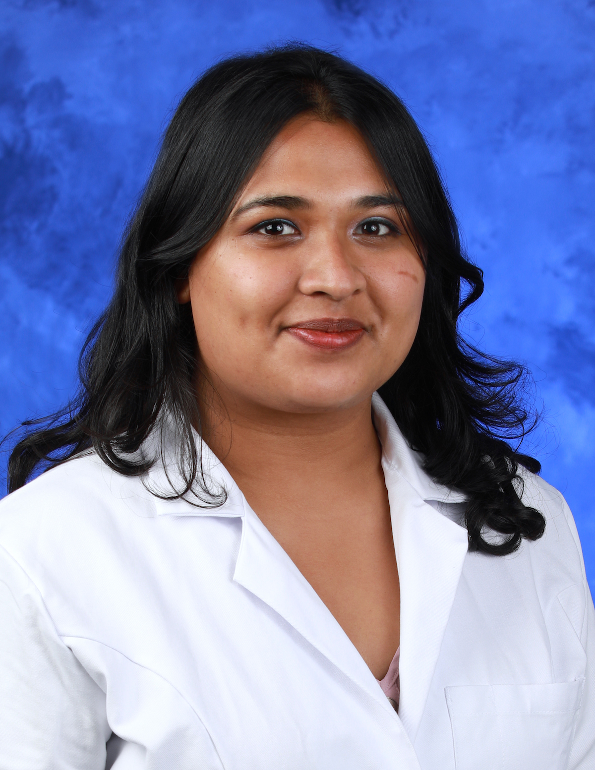 Dr. Priyanka Lakshmanan is pictured in a professional head-and-shoulders photo