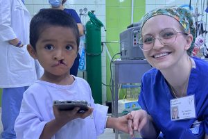 Dr. Heather Schopper with a child in Peru